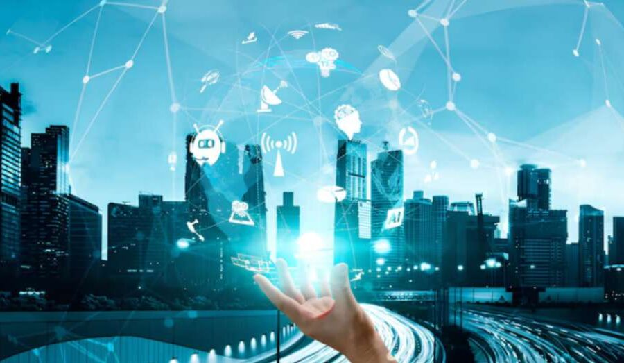 Hand holding digital icons with a smart city background, symbolizing advanced communication, global internet, and digital transformation.