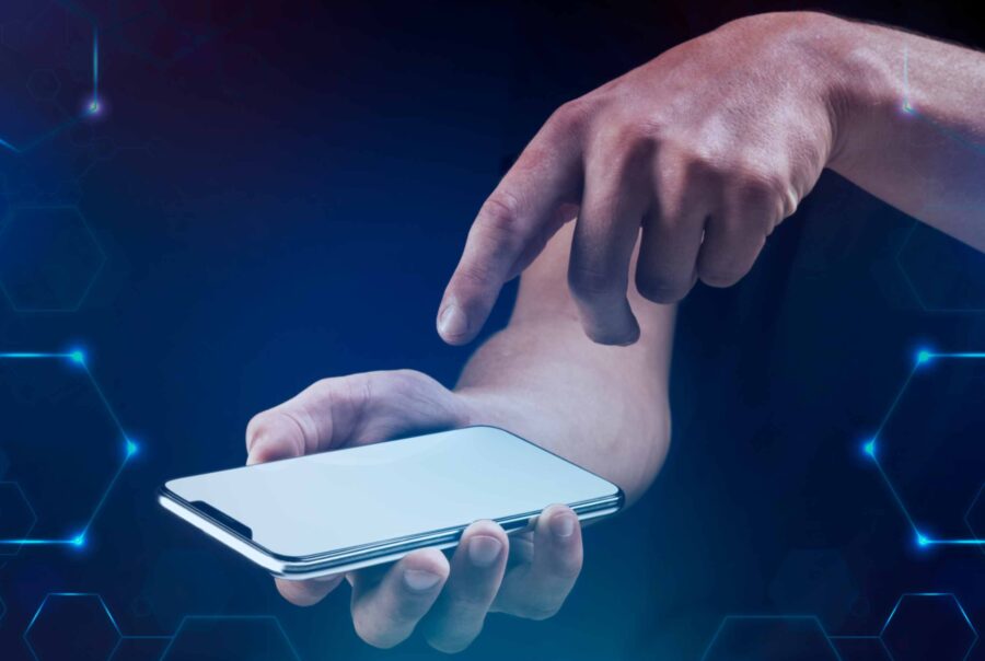 A person holding a smartphone displaying a health app, symbolizing mobile health technology for improving healthcare outcomes in low and middle-income countries (LMICs)