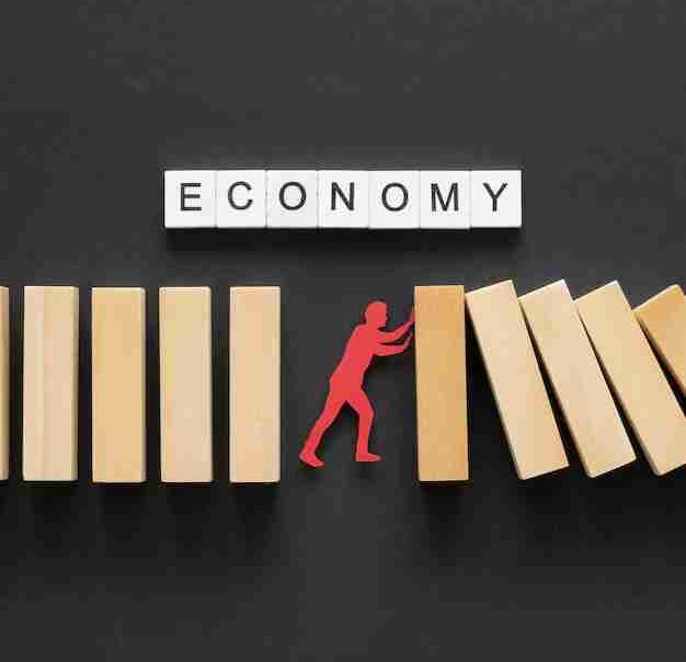 A symbolic figure stopping falling dominoes under the word 'economy,' representing efforts to address systemic economic injustices.
